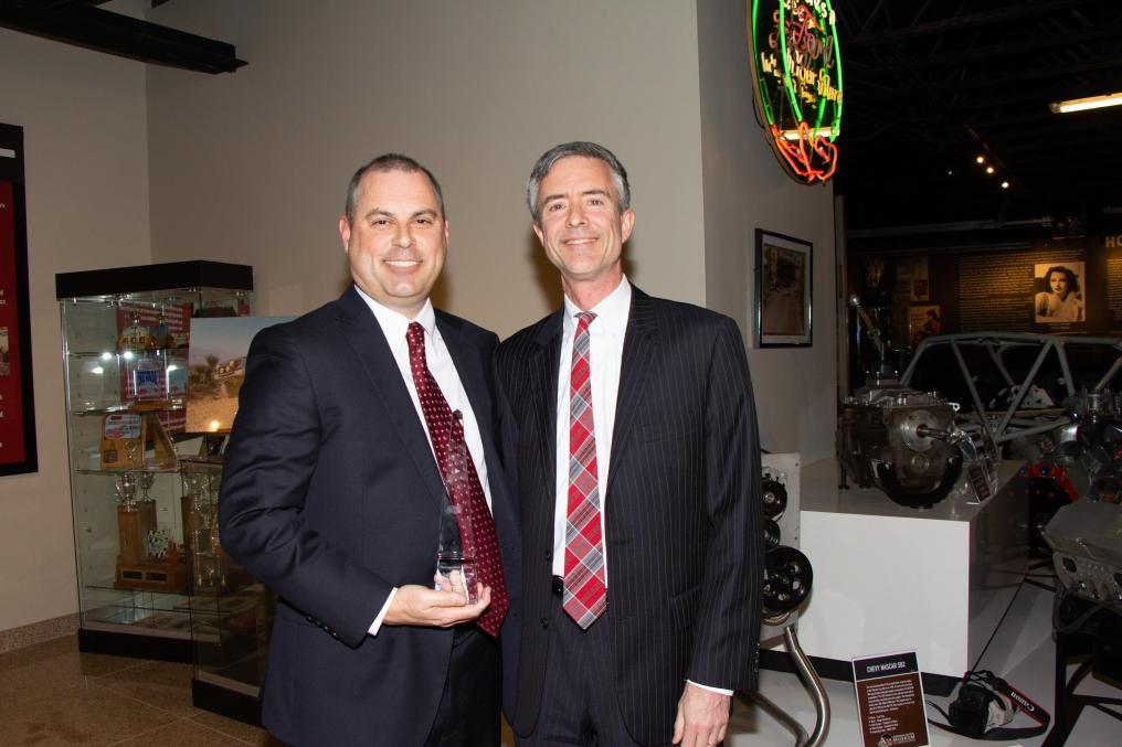 Patrick Cooper receives Distinguished Service Award from Mark Laughlin.