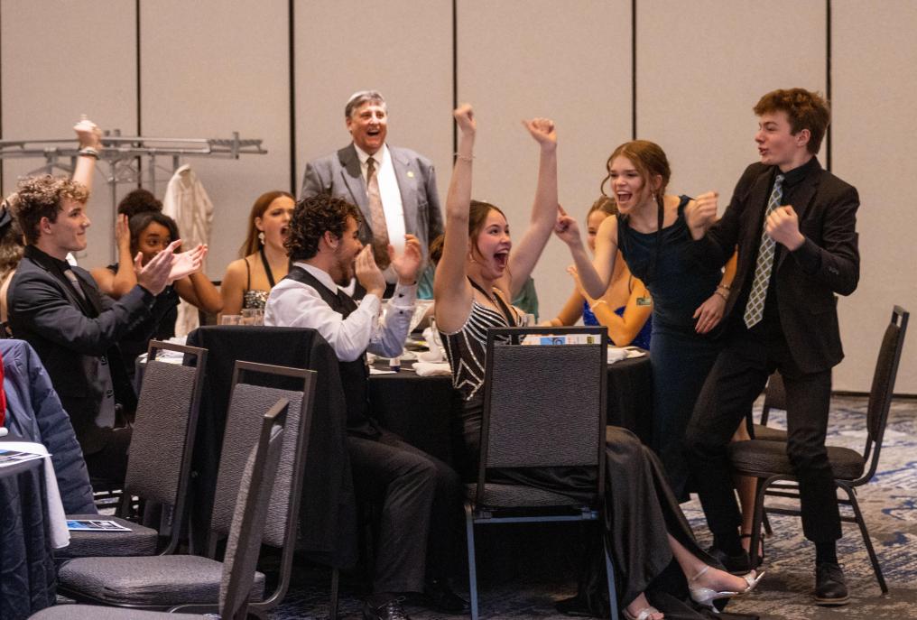 Wayne mock trial team celebrates after winning a trivia point.
