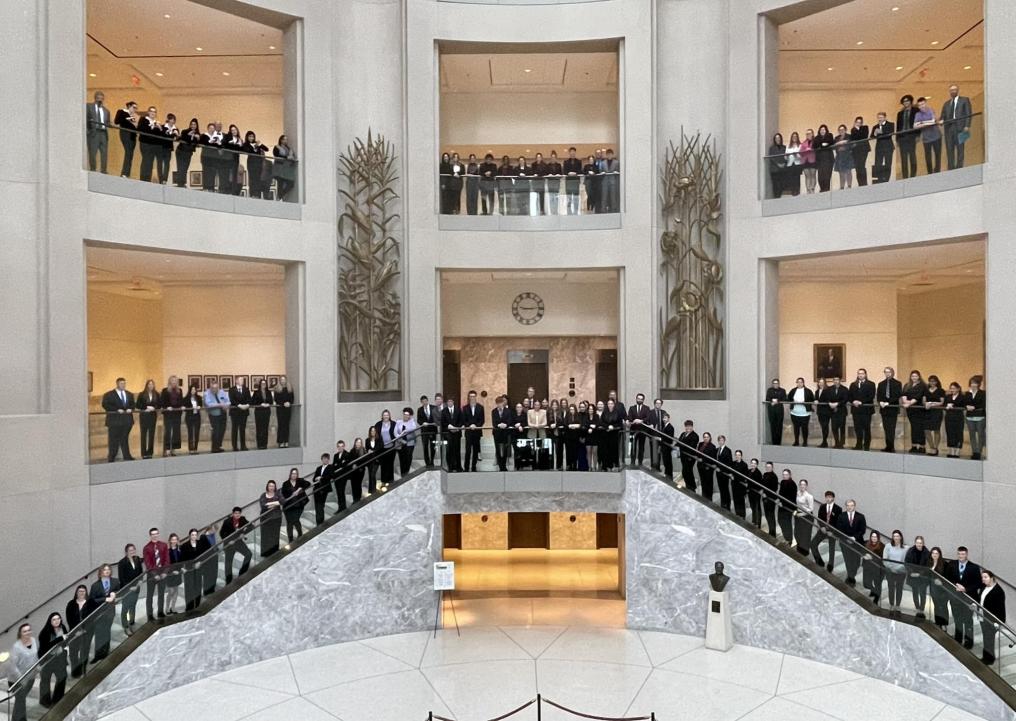 Hundreds of students stand in Hruska Federal Courthouse