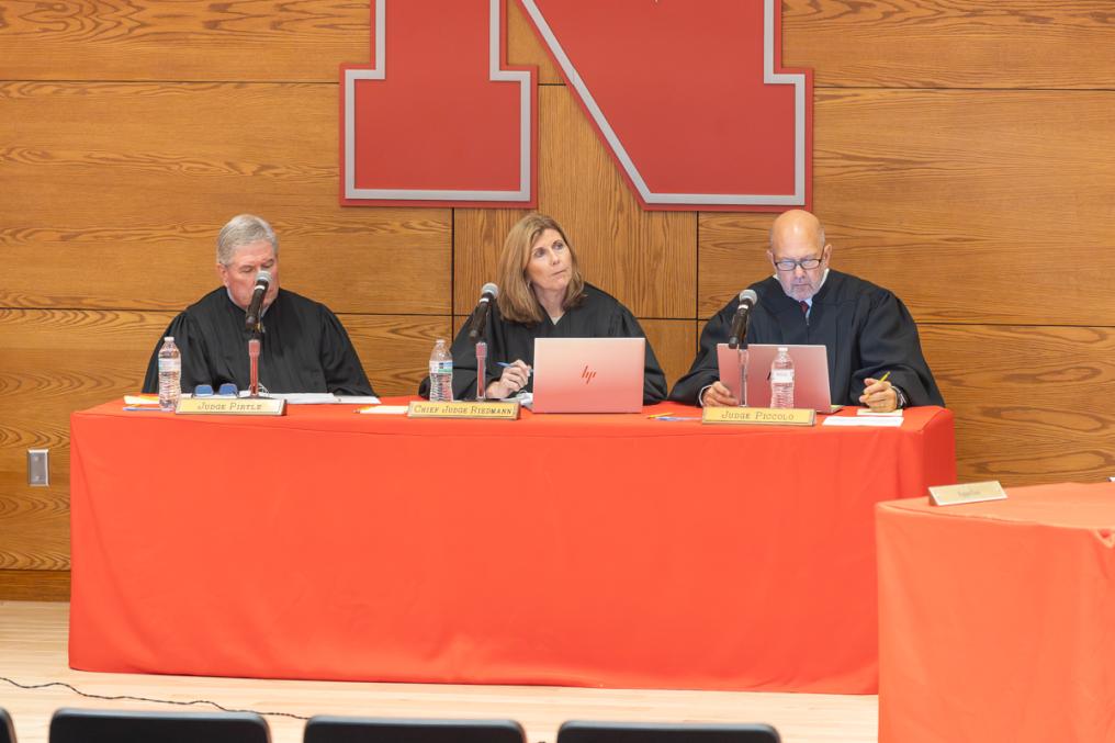 Judge Michael Pirtle (left), Chief Judge Francie Riedmann (center), and Judge Michael Piccolo (right) listen to oral arguments at UNL